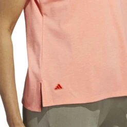 Adidas 2023 Women's Go-To Heathered Polo -Golf Shop adidas 23 womens go to heathered polo coral fusion detail2 itempicture