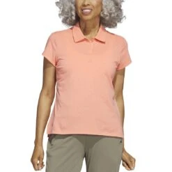 Adidas 2023 Women's Go-To Heathered Polo -Golf Shop adidas 23 womens go to heathered polo coral fusion itempicture